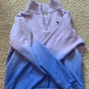 PINK quarter zip sweatshirt.